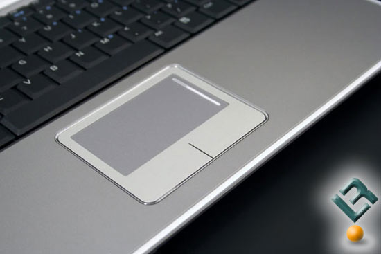 The touchpad has integrated soft-click pads, rather than individual mouse 